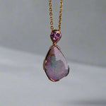 This exquisite 9k gold pendant features a genuine Australian Boulder Opal, showcasing vivid pink and green hues that captivate the eye. Expertly crafted to highlight the opal’s natural brilliance, this piece combines durability with elegant design, making it a timeless addition to any fine jewelry collection.