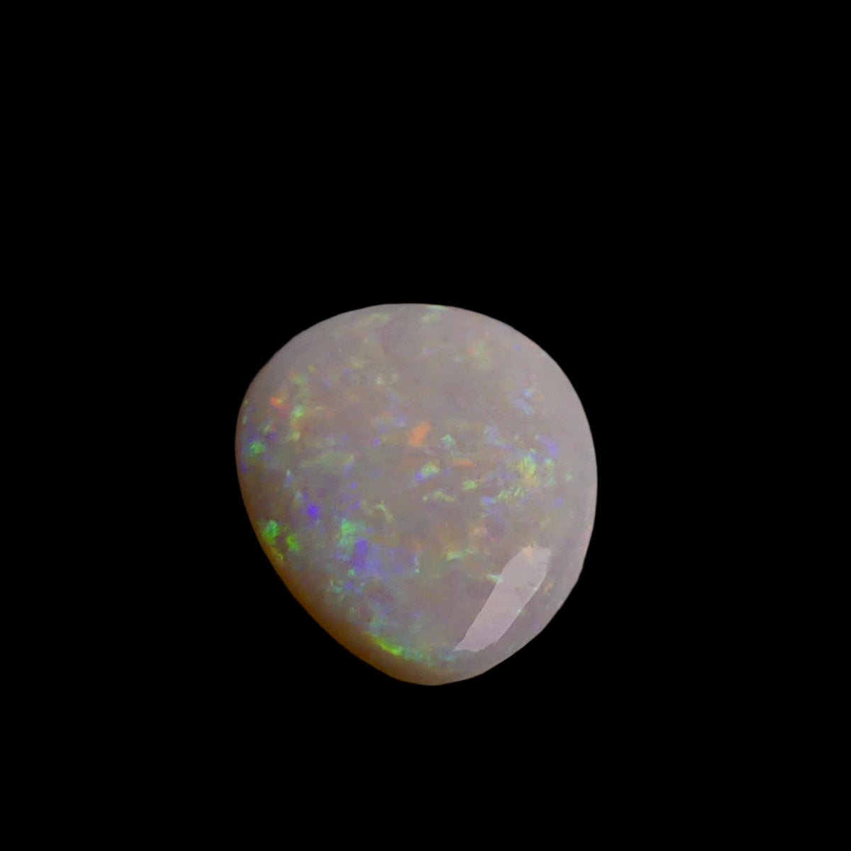 This 6.4-carat Cobber Pedy opal features delicate pastel patterns that showcase the gemstone’s unique play of color and fine Australian craftsmanship. Its subtle yet vibrant hues make it a distinguished choice for collectors and designers seeking an elegant and naturally captivating opal.
