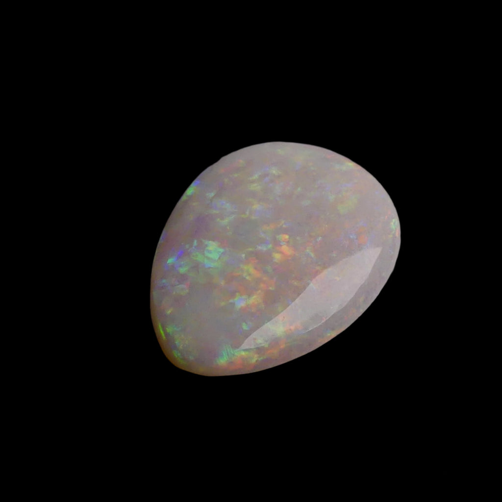 This 6.4-carat Cobber Pedy opal features delicate pastel patterns that showcase the gemstone’s unique play of color and fine Australian craftsmanship. Its subtle yet vibrant hues make it a distinguished choice for collectors and designers seeking an elegant and naturally captivating opal.