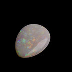 This 6.4-carat Cobber Pedy opal features delicate pastel patterns that showcase the gemstone’s unique play of color and fine Australian craftsmanship. Its subtle yet vibrant hues make it a distinguished choice for collectors and designers seeking an elegant and naturally captivating opal.