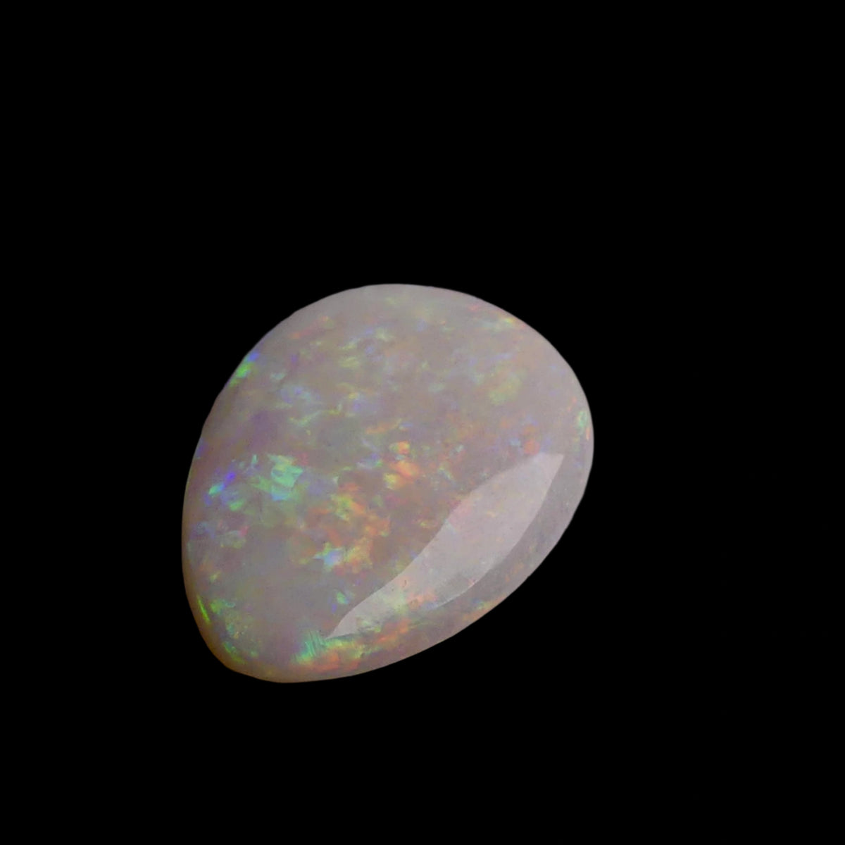 This 6.4-carat Cobber Pedy opal features delicate pastel patterns that showcase the gemstone’s unique play of color and fine Australian craftsmanship. Its subtle yet vibrant hues make it a distinguished choice for collectors and designers seeking an elegant and naturally captivating opal.