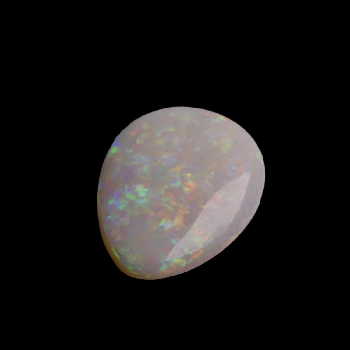 This 6.4-carat Cobber Pedy opal features delicate pastel patterns that showcase the gemstone’s unique play of color and fine Australian craftsmanship. Its subtle yet vibrant hues make it a distinguished choice for collectors and designers seeking an elegant and naturally captivating opal.