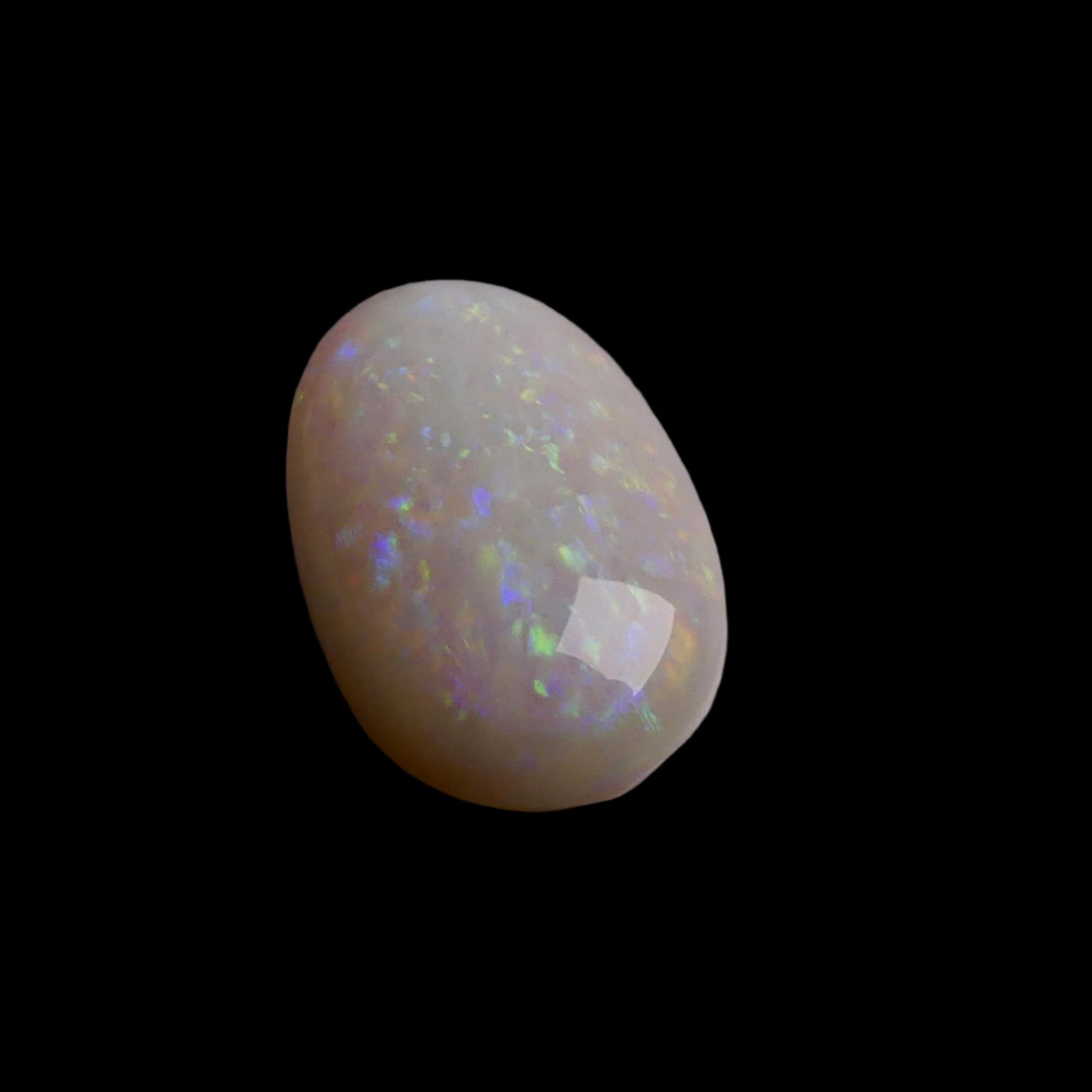 This 4.4-carat Coober Pedy opal displays a vibrant spectrum of colors, hallmark traits of this prestigious Australian opal. Expertly cut to highlight its natural brilliance, it offers a rare combination of size and quality.