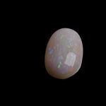This 4.4-carat Coober Pedy opal displays a vibrant spectrum of colors, hallmark traits of this prestigious Australian opal. Expertly cut to highlight its natural brilliance, it offers a rare combination of size and quality.