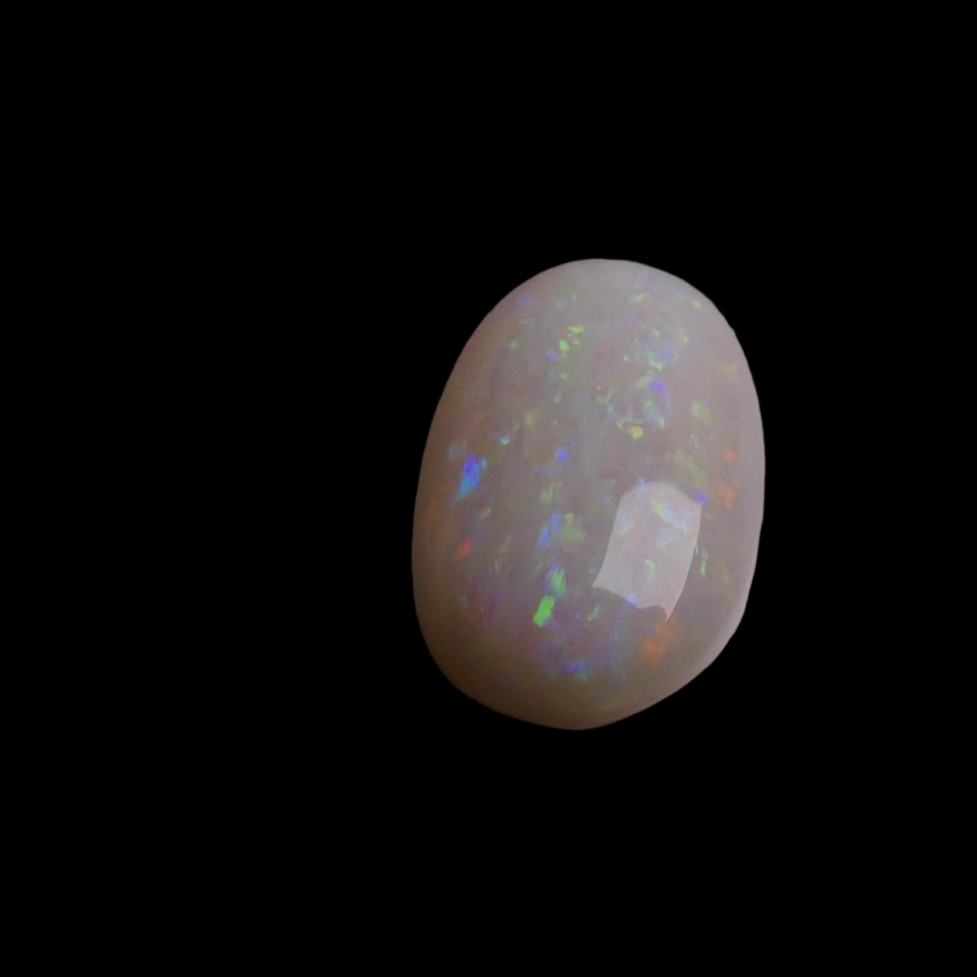 This 4.4-carat Coober Pedy opal displays a vibrant spectrum of colors, hallmark traits of this prestigious Australian opal. Expertly cut to highlight its natural brilliance, it offers a rare combination of size and quality.