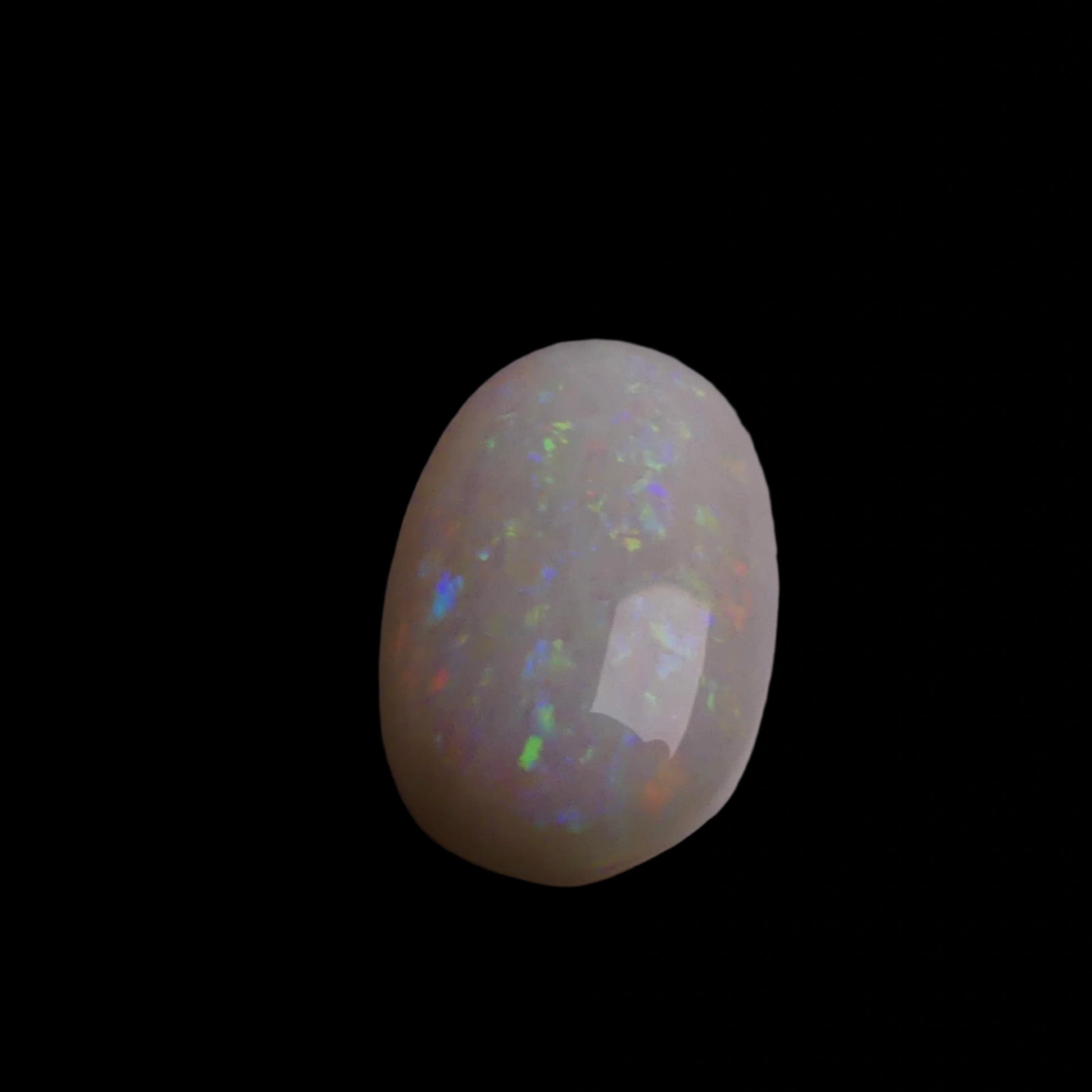 This 4.4-carat Coober Pedy opal displays a vibrant spectrum of colors, hallmark traits of this prestigious Australian opal. Expertly cut to highlight its natural brilliance, it offers a rare combination of size and quality.
