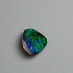 Embrace the stunning beauty of the "Ocean Blue" 2.8ct Australian Boulder Opal, a ring stone that radiates vibrant ocean blues and greens. This exquisite opal captures the essence of the ocean with its brilliant color play, making it an irresistible choice for a unique and elegant jewelry piece.