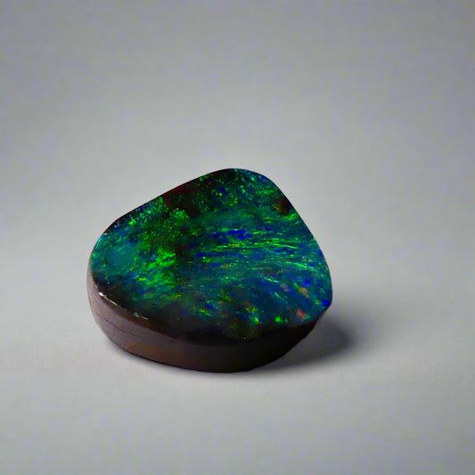 Embrace the stunning beauty of the "Ocean Blue" 2.8ct Australian Boulder Opal, a ring stone that radiates vibrant ocean blues and greens. This exquisite opal captures the essence of the ocean with its brilliant color play, making it an irresistible choice for a unique and elegant jewelry piece.