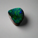 Embrace the stunning beauty of the "Ocean Blue" 2.8ct Australian Boulder Opal, a ring stone that radiates vibrant ocean blues and greens. This exquisite opal captures the essence of the ocean with its brilliant color play, making it an irresistible choice for a unique and elegant jewelry piece.