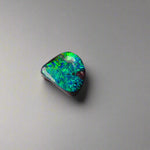 Discover the captivating beauty of this 1.8ct Ocean Blue Australian Boulder Opal. Its vibrant blue hues and natural patterns make it a unique opal, Sourced from Australia’s renowned Opalton opal fields, this opal promises both rarity and lasting brilliance.