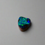 Experience the allure of this stunning 1.90ct Australian Boulder Opal, glowing with vivid green and blue hues. Its vibrant colors and natural brilliance make it an ideal centerpiece for a ring, offering a unique and elegant statement.
