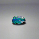 Experience the allure of this stunning 1.90ct Australian Boulder Opal, glowing with vivid green and blue hues. Its vibrant colors and natural brilliance make it an ideal centerpiece for a ring, offering a unique and elegant statement.
