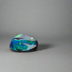 Experience the allure of this stunning 1.90ct Australian Boulder Opal, glowing with vivid green and blue hues. Its vibrant colors and natural brilliance make it an ideal centerpiece for a ring, offering a unique and elegant statement.
