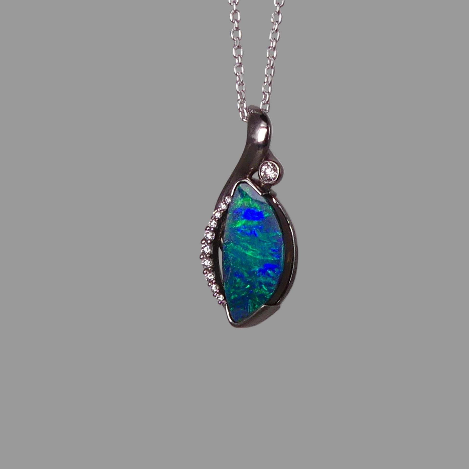 Opal pendant necklace on a gray background
