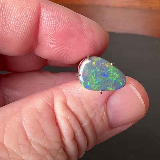 Expertly cut and polished, this 2.4ct Australian Black Opal adds an alluring touch of shimmer to any jewelry piece. Its stunning colors of green, gold, and blue make it a unique and captivating gemstone. Perfect for creating one-of-a-kind pieces and standing out in any collection.

Origin- Ethically Mined in Lightning Ridge Australia

Opal Weight- 2.4ct Australian Lightning Ridge Opal

Body Tone- N6

Size- 12 x 8.2mm

Beautiful Ring or Pendant Opal ready to be set.