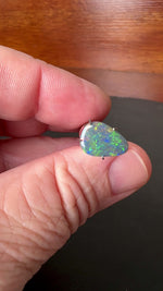 Expertly cut and polished, this 2.4ct Australian Black Opal adds an alluring touch of shimmer to any jewelry piece. Its stunning colors of green, gold, and blue make it a unique and captivating gemstone. Perfect for creating one-of-a-kind pieces and standing out in any collection.

Origin- Ethically Mined in Lightning Ridge Australia

Opal Weight- 2.4ct Australian Lightning Ridge Opal

Body Tone- N6

Size- 12 x 8.2mm

Beautiful Ring or Pendant Opal ready to be set.