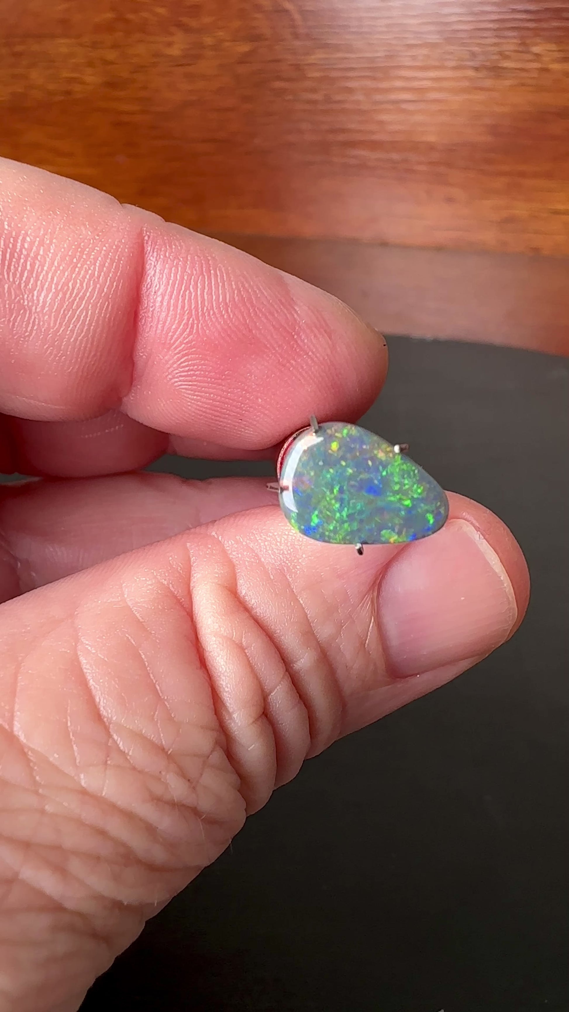 Expertly cut and polished, this 2.4ct Australian Black Opal adds an alluring touch of shimmer to any jewelry piece. Its stunning colors of green, gold, and blue make it a unique and captivating gemstone. Perfect for creating one-of-a-kind pieces and standing out in any collection.

Origin- Ethically Mined in Lightning Ridge Australia

Opal Weight- 2.4ct Australian Lightning Ridge Opal

Body Tone- N6

Size- 12 x 8.2mm

Beautiful Ring or Pendant Opal ready to be set.