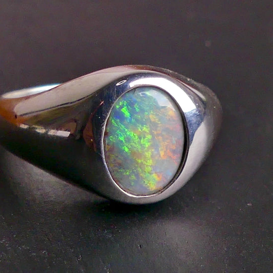 Expertly crafted with solid sterling silver and showcasing a beautiful and vibrant boulder opal, this ring is a stunning addition to any jewelry collection. The unique combination of metal and gemstone offers a timeless and elegant look, perfect for any occasion. Elevate your style with this exquisite piece

Opal Weight- 2ct

Setting- Sterling Silver Bezel Set

Size- 7us

Crafted By Australian Artisans