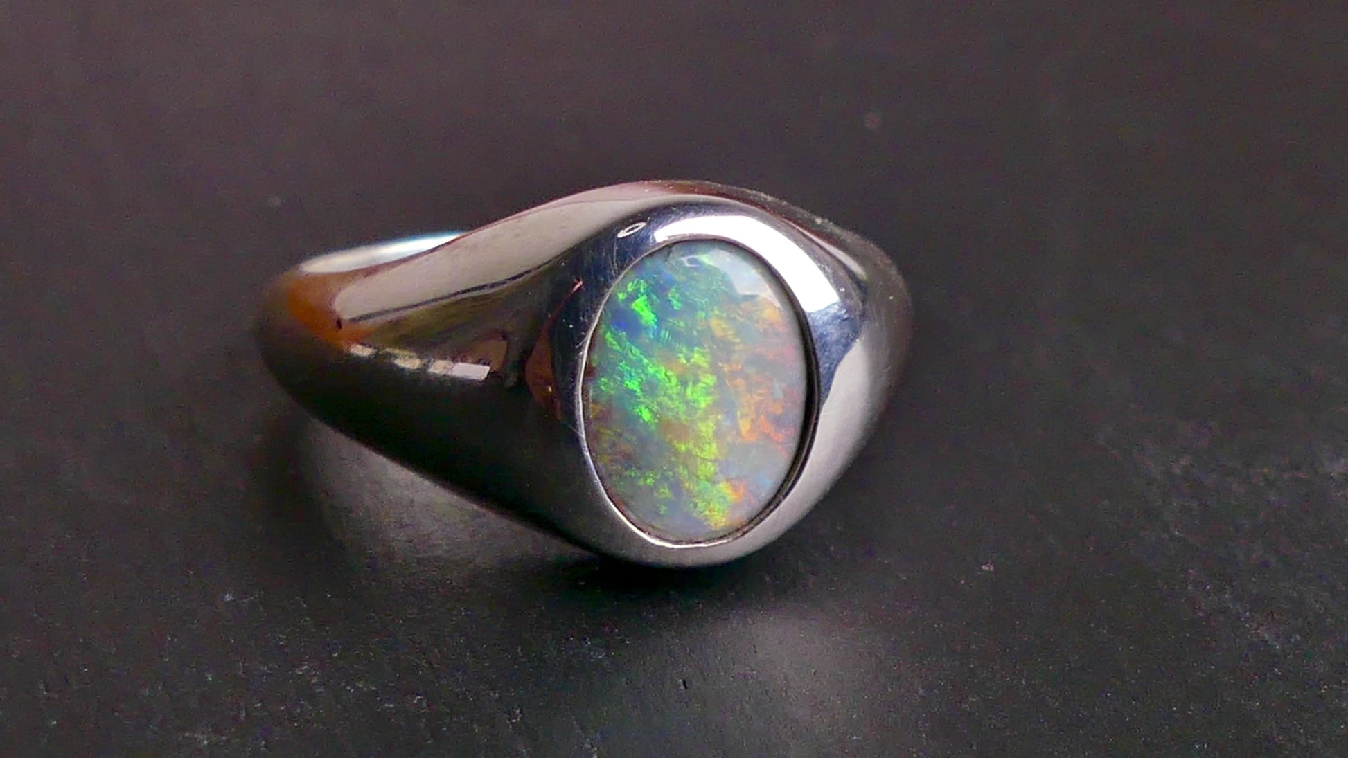 Expertly crafted with solid sterling silver and showcasing a beautiful and vibrant boulder opal, this ring is a stunning addition to any jewelry collection. The unique combination of metal and gemstone offers a timeless and elegant look, perfect for any occasion. Elevate your style with this exquisite piece

Opal Weight- 2ct

Setting- Sterling Silver Bezel Set

Size- 7us

Crafted By Australian Artisans