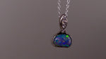 This exquisite pendant features a rare Australian Boulder Opal set in 18k white gold, expertly crafted to highlight the opal’s vibrant play of colors. Accented with natural diamonds, this statement piece that combines exceptional craftsmanship with the distinctive allure of genuine opal.