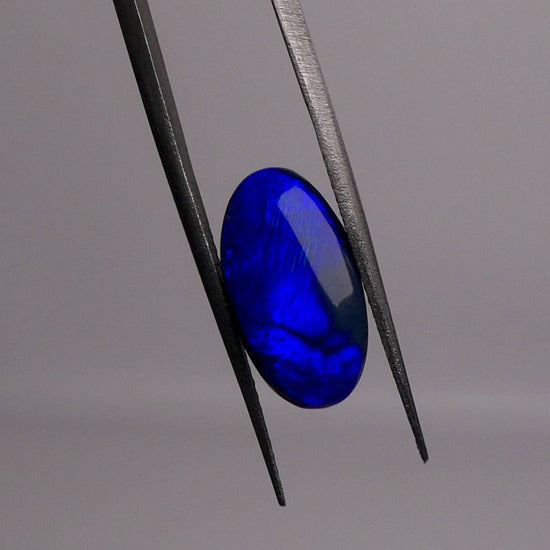 Discover the captivating allure of 3.2ct Australian Black Opal. Delighting the eye with a dazzling electric blue and hints of green, this phenomenal gemstone is a true treasure. Elevate your collection with this extraordinarily rare and precious gemstone.

Origin- Lightning Ridge Australia

Opal Weight- 3.2ct electric Blue on Black Opal

Cut- Freeform cabochon

Size- 14x7.6mm

