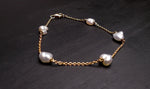 Expertly crafted with 9k gold and 5 Keshi pearls, our Elegant Keshi Pearl Bracelet exudes timeless sophistication. Each pearl's unique shape adds to the overall elegance of the piece, making it a perfect accessory for any occasion. Elevate your style with this exquisite bracelet.

Pearl- Keshi Saltwater Pearls

Setting- Handcrafted 9k Gold

Handcrafted By Australian Artisans