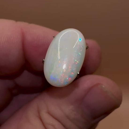 This Coober Pedy Opal showcases stunning pink and blue hues, adding a touch of elegance to any jewelry piece, perfect for any setting.

Origin- Ethically mined in Coober Pedy Australia

Weight- 4.9ct

Size- 17 x 10.6mm