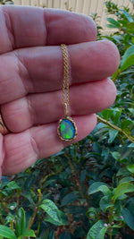 Uncover the stunning Australian opal beauty of our 9k Gold Lightning Ridge Opal pendant. Featuring a unique lava-inspired handcrafted design with green, blue, and gold tones, this high-quality masterpiece is a lasting addition to your collection.

Origin- Ethically Mined in Lightning Ridge Australia

Opal Weight- 1.5ct Lightning Ridge Crystal Opal

Setting- 9k Gold Lava inspired custom design

Chain- 9k Gold Cable Chain 45cm in Length

Treatments- None- 100% Solid Australian Opal
