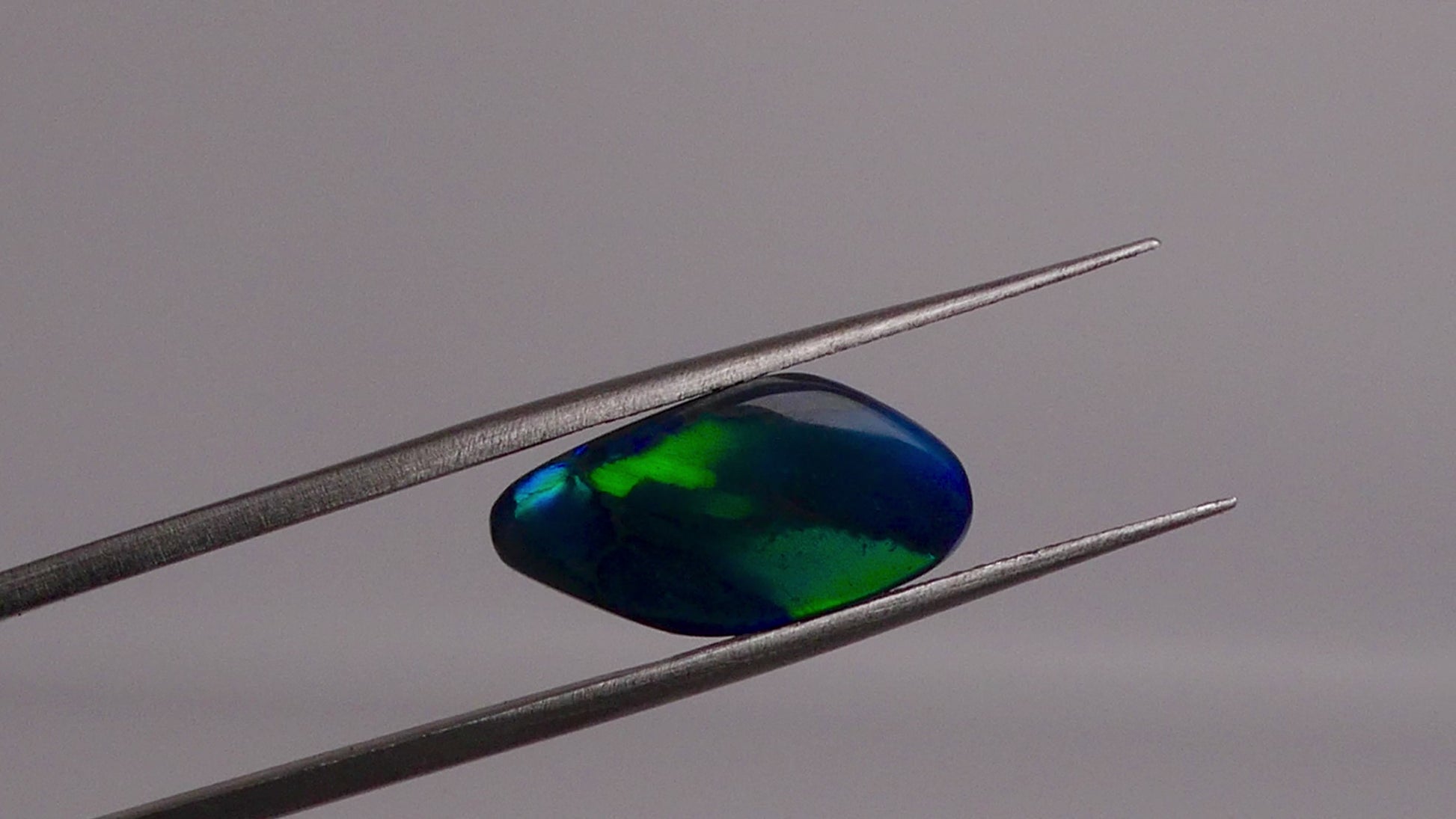 Discover the beauty of the unique 3.5ct Australian Black Opal. With its rare pattern exhibiting stunning blues and greens, this opal is truly one of a kind. Add a touch of rarity and elegance to your collection.

Origin- Lightning Ridge Australlia

Opal Weight- 3.5ct Australian Black Opal

Size- 15.8x8mm

Cut- Freeform cabochon