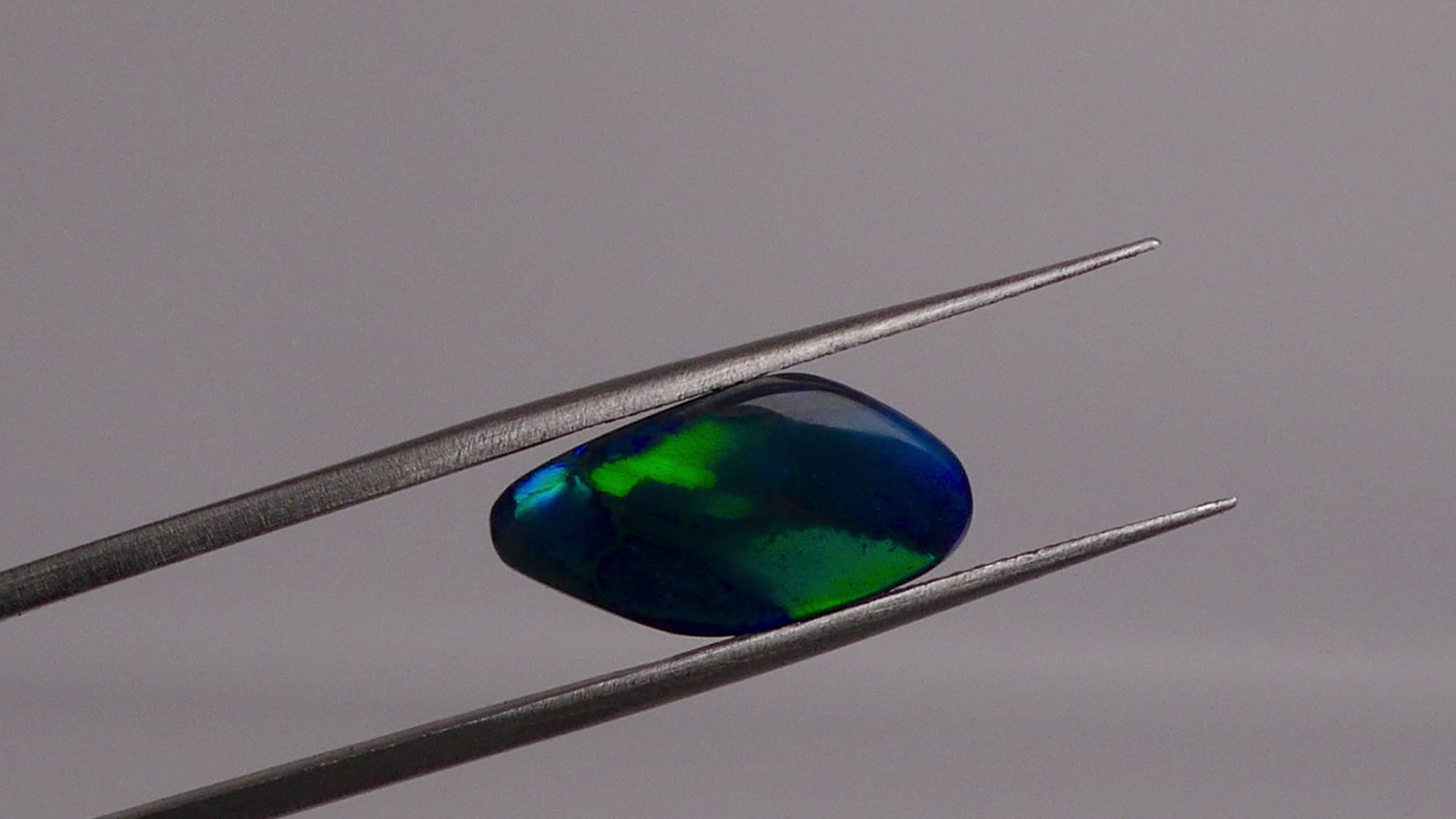 Discover the beauty of the unique 3.5ct Australian Black Opal. With its rare pattern exhibiting stunning blues and greens, this opal is truly one of a kind. Add a touch of rarity and elegance to your collection.

Origin- Lightning Ridge Australlia

Opal Weight- 3.5ct Australian Black Opal

Size- 15.8x8mm

Cut- Freeform cabochon