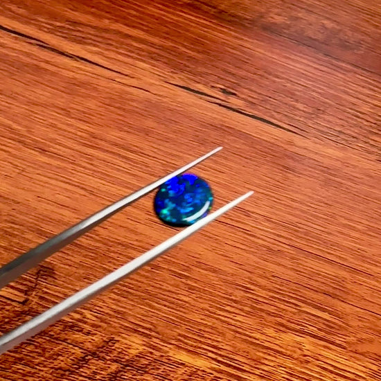 This 1.95ct Black Opal from Lightning Ridge displays stunning blue green hues, making it a unique and valuable addition to any collection. Its distinct color and quality of origin, make it a desirable choice for those seeking a rare and eye-catching gemstone.

Origin- Lightning Ridge Australia

Weight- 1.95ct Black Opal

Size- 10x9x3mm

Cut- Oval Freeform Low Dome Cabochon

Treatments- None 100% solid Australian Opal

Perfect Opal for your custom piece of jewellery or your collection