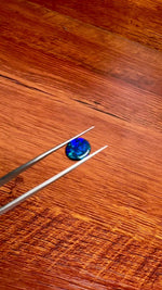 This 1.95ct Black Opal from Lightning Ridge displays stunning blue green hues, making it a unique and valuable addition to any collection. Its distinct color and quality of origin, make it a desirable choice for those seeking a rare and eye-catching gemstone.

Origin- Lightning Ridge Australia

Weight- 1.95ct Black Opal

Size- 10x9x3mm

Cut- Oval Freeform Low Dome Cabochon

Treatments- None 100% solid Australian Opal

Perfect Opal for your custom piece of jewellery or your collection