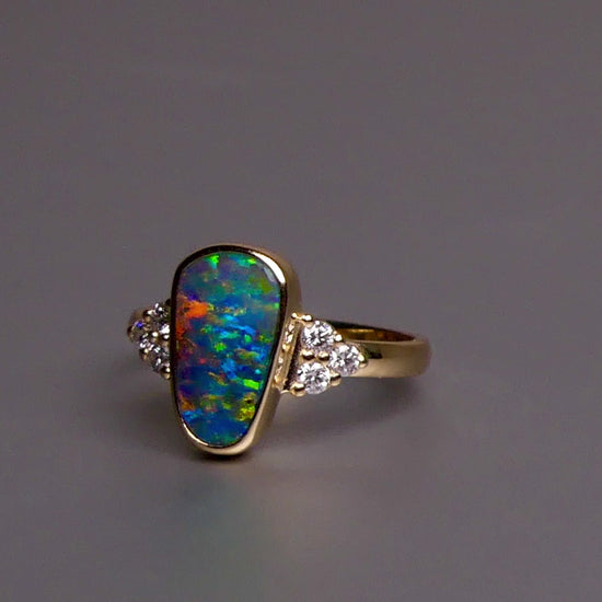 Expertly crafted, this stunning ring features a rare Australian gem boulder opal set in 14k gold and adorned with sparkling diamonds. The unique combination of precious materials and meticulous design makes this ring a one-of-a-kind piece, perfect for any special occasion or as a luxurious addition to any jewelry collection.

Origin- Queensland Australia

Opal Weight- 2.2ct Gem Australian Boulder Opal

Accent Stones- Natural Diamonds

Setting- 14K Gold Bezel Set

Size- 7 1/2 us
