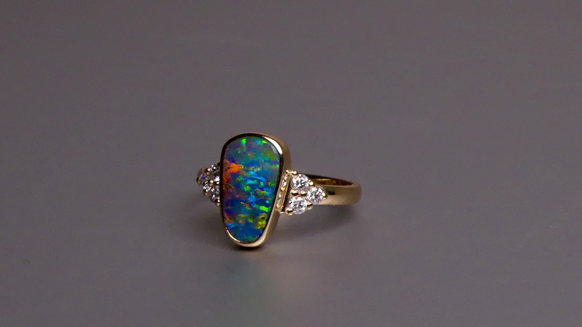 Expertly crafted, this stunning ring features a rare Australian gem boulder opal set in 14k gold and adorned with sparkling diamonds. The unique combination of precious materials and meticulous design makes this ring a one-of-a-kind piece, perfect for any special occasion or as a luxurious addition to any jewelry collection.

Origin- Queensland Australia

Opal Weight- 2.2ct Gem Australian Boulder Opal

Accent Stones- Natural Diamonds

Setting- 14K Gold Bezel Set

Size- 7 1/2 us
