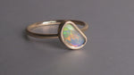 This Elegant 9ct Gold Ring is perfect for any occasion. Made with a stunning Crystal Opal from Lightning Ridge, displaying the full spectrum of colors, making it a unique and eye-catching piece. Its simple and elegant design adds a touch of sophistication to any outfit.

Origin- Lightning Ridge Australia

Opal- Australian Crystal Opal mined in Lightning Ridge Australia

Setting- 9ct solid Gold Bezel set

Size- 6 1/2 us

Designed and Handcrafted by skilled Australian Artisans