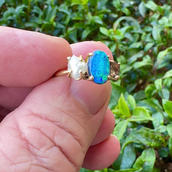 Experience the stunning harmony of nature with our 14k gold Australian Black Opal ring from our Seascapes Collection.

Origin- Lightning Ridge Australia

Opal Weight- 1ct Australian Black Opal

Accent Stone - Mauve Tourmaline

Pearl- Keshi pearl

Setting- 14k gold claw

Ring Size - 6 1/2 us

Handcrafted and designed by Australian Artisians