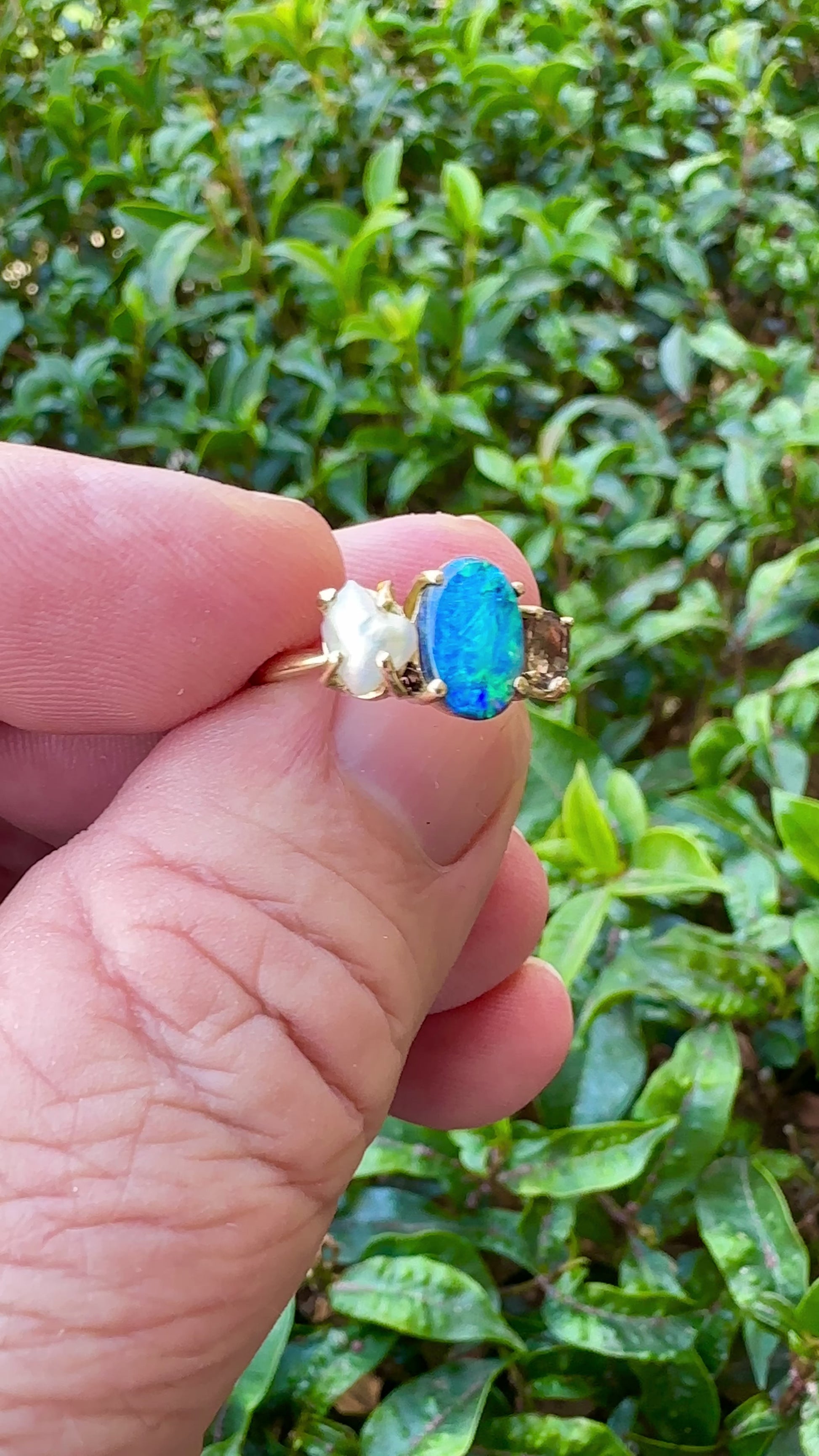 Experience the stunning harmony of nature with our 14k gold Australian Black Opal ring from our Seascapes Collection.

Origin- Lightning Ridge Australia

Opal Weight- 1ct Australian Black Opal

Accent Stone - Mauve Tourmaline

Pearl- Keshi pearl

Setting- 14k gold claw

Ring Size - 6 1/2 us

Handcrafted and designed by Australian Artisians
