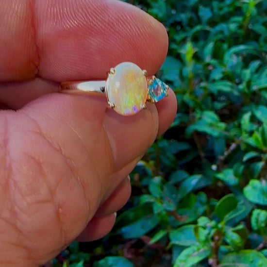 Introducing our stunning 14k Gold Australian Crystal Opal Ring. Ethically sourced from Lightning Ridge Australia, its mesmerizing play-of-color is unlike any other. Each piece is truly one-of-a-kind

Origin- Lightning Ridge Australia

Opal Weight- 1ct Australian Crystal Opal

Setting- 14k Claw Setting

Accent Stone- Swiss Blue Topaz

Ring Size- 6 1/2us.

Handcrafted with precision and passion by Australian Artisans.