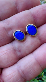 Expertly crafted Lightning Ridge Australian Gold Opal Earrings - an exquisite and unique addition to your jewelry collection. Handcrafted with exceptional attention to detail.

Origin- Lightning Ridge Australia

Opal Weight- Combined weight of 2.4ct Lightning Ridge Seam Opal

Setting- 9K Gold Bezel Set Stud Earrings

Handcrafted and designed by Australian Artisans