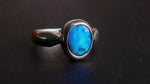 This Vibrant Sterling Silver Boulder Opal Ring showcases stunning ocean blue hues, making it a truly eye-catching accessory. Crafted with high-quality sterling silver and featuring a boulder opal, this ring is both beautiful and durable. Elevate any outfit with this striking piece of jewelry.

Origin- Ethically mined in Queensland Australia

Opal Weight- 1.9ct

Setting- Sterling Silver

Size- 6 1/2us

Crafted By Passionate Australian Artisans
